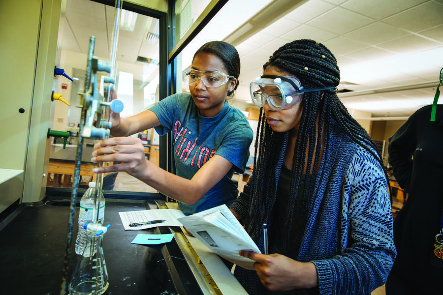 Two students in a science classroom